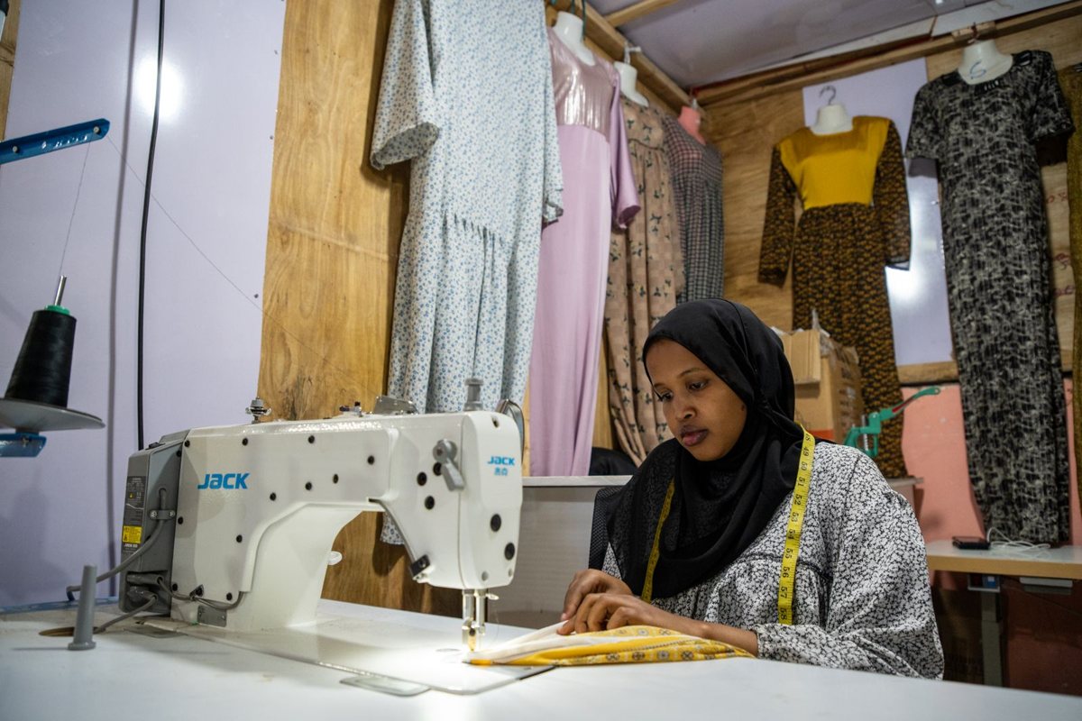 Sakhia Deeq at her sewing machine in Abid Fashion