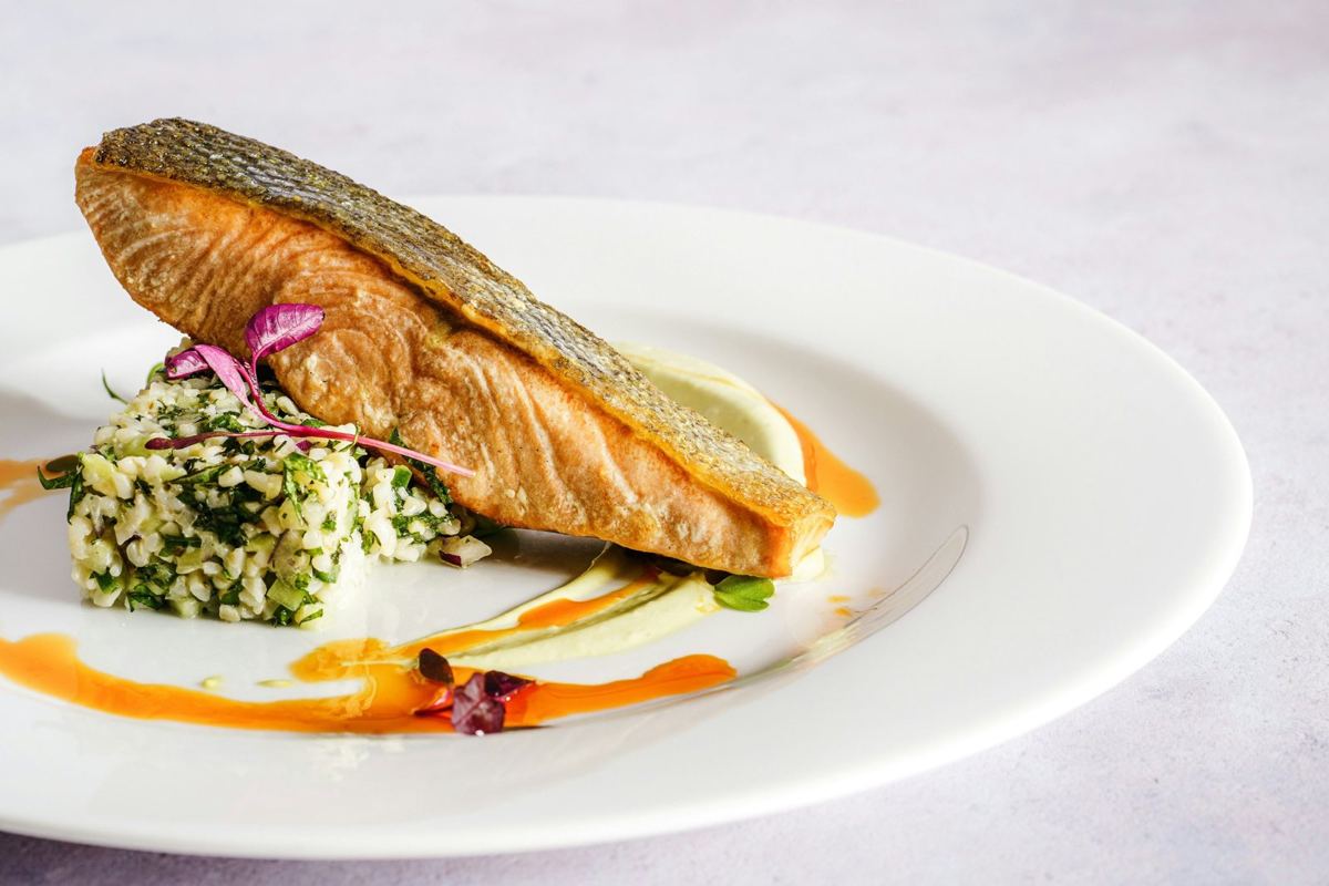 A grilled fish fillet served on a plate