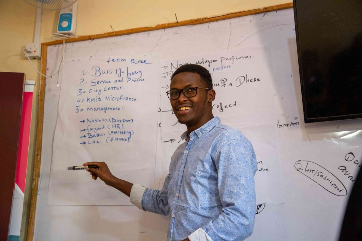 A YEEL trainer teaching at a whiteboard