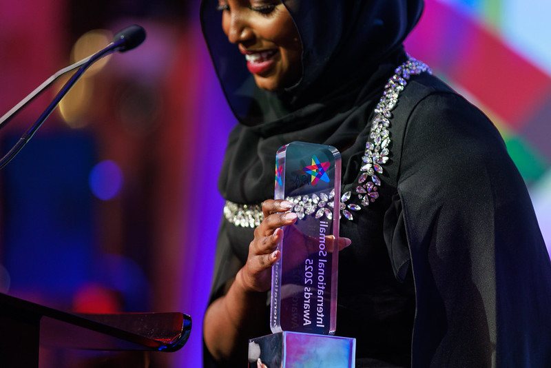 A winner holding her award