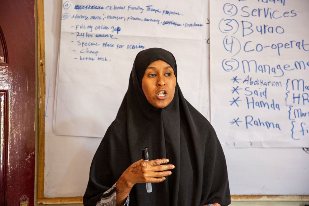 A young woman presenting in a YEEL class