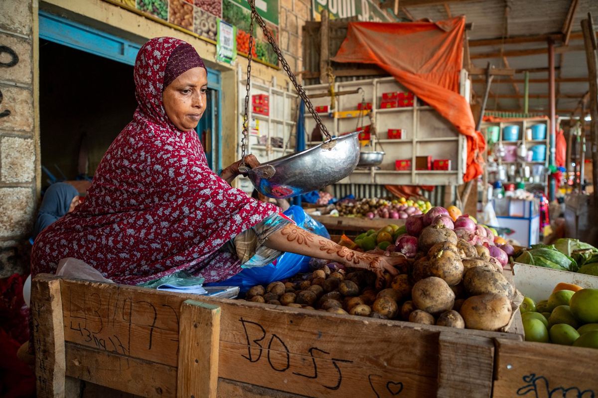 A vegetable seller at her stall