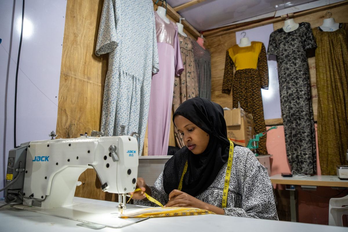 Sakhia Deeq at her sewing machine in Abid Fashion