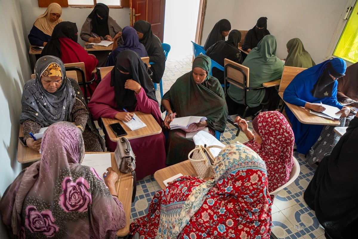 Women working in pairs during a class in Burao